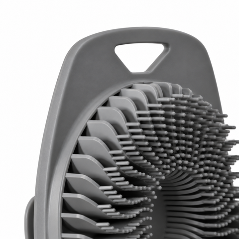 Close-up of gray silicone body scrubber hanging opening