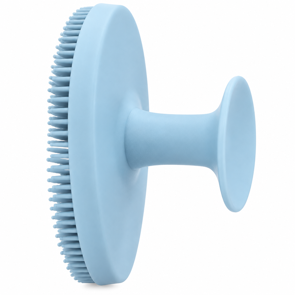 Close-up of light blue silicone facial cleansing brush rear finger grip
