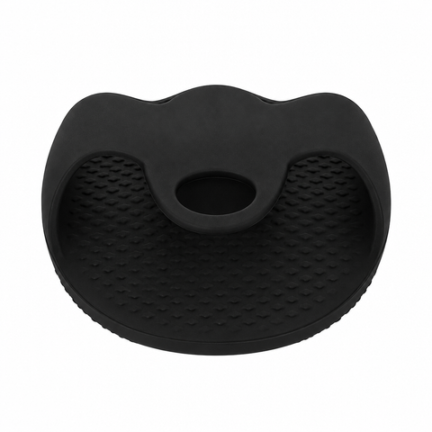 ear view of the black silicone bath body brush showing its integrated hand grip.