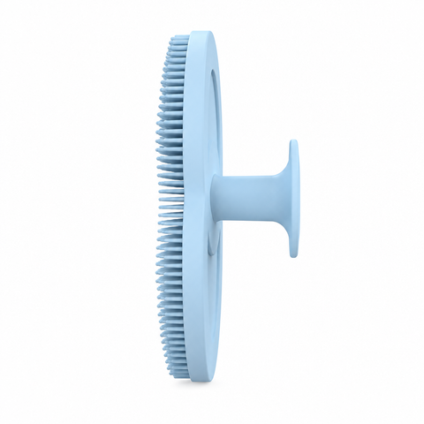 Light blue silicone facial cleansing brush, side profile with finger grip