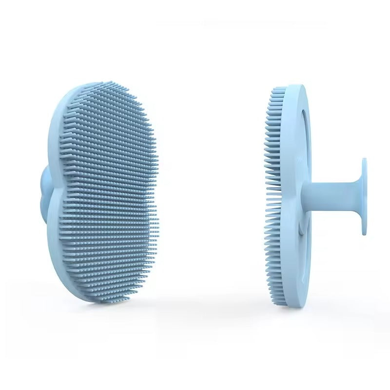 Light blue silicone facial cleansing brush shown from the bristle side and side profile
